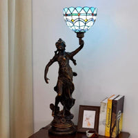 Tiffany style table lamp featuring a Statue design, combining artistic sculpture and elegant glasswork.